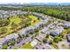 Aerial view of community with pool, golf course, and numerous buildings at 4893 Magnolia Pointe Ln. # 305, Myrtle Beach, SC 29577