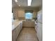 Modern kitchen with white cabinets and stainless steel appliances at 4893 Magnolia Pointe Ln. # 305, Myrtle Beach, SC 29577