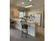 Modern kitchen with white cabinets, breakfast bar and appliances at 4893 Magnolia Pointe Ln. # 305, Myrtle Beach, SC 29577
