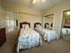 Guest bedroom with twin beds and mirrored closet doors at 4893 Magnolia Pointe Ln. # 305, Myrtle Beach, SC 29577