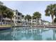Resort-style pool with palm trees and building reflection at 4893 Magnolia Pointe Ln. # 305, Myrtle Beach, SC 29577