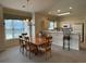 Dining room with large table and view to kitchen at 4893 Magnolia Pointe Ln. # 305, Myrtle Beach, SC 29577