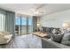 Bright living room boasts ocean views and comfy seating at 1625 S Ocean Blvd. # 1002, North Myrtle Beach, SC 29582