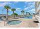 Relaxing pool and hot tub area with palm trees and beach access at 1625 S Ocean Blvd. # 1002, North Myrtle Beach, SC 29582