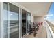 Spacious balcony showcasing ocean views and access to the condo's living area at 1625 S Ocean Blvd. # 1002, North Myrtle Beach, SC 29582
