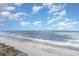 Aerial view of a beautiful beach with clear water and blue sky at 1625 S Ocean Blvd. # 1002, North Myrtle Beach, SC 29582