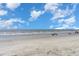 Expansive beach view with calm ocean and clear sky at 1625 S Ocean Blvd. # 1002, North Myrtle Beach, SC 29582