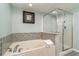 Relaxing bathroom with soaking tub and shower at 1625 S Ocean Blvd. # 1002, North Myrtle Beach, SC 29582