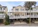 Two-story beach home with elevated deck and parking underneath at 6001-G3 S Kings Hwy., Myrtle Beach, SC 29575