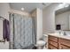 Clean bathroom with shower, vanity, and neutral tile at 190 Campania St., Myrtle Beach, SC 29579