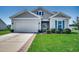 Beautiful Craftsman style home with gray siding and teal accents at 190 Campania St., Myrtle Beach, SC 29579