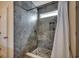 Walk-in shower with pebble floor and stone tile surround at 190 Campania St., Myrtle Beach, SC 29579