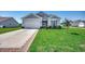 Charming house with gray siding, landscaping, and a paved driveway at 190 Campania St., Myrtle Beach, SC 29579