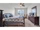 King-size bedroom with ceiling fan, dresser, and comfortable seating at 190 Campania St., Myrtle Beach, SC 29579