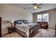 Spacious bedroom with a king-size bed and a leather recliner at 190 Campania St., Myrtle Beach, SC 29579