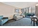 Condo living room with balcony access and seating at 1105 S Ocean Blvd. # 106, Myrtle Beach, SC 29577