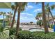 Oceanfront pool area with palm trees and lounge chairs at 1105 S Ocean Blvd. # 106, Myrtle Beach, SC 29577