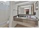 Bathroom with granite vanity, mirror, and shower/tub at 1105 S Ocean Blvd. # 106, Myrtle Beach, SC 29577
