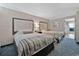 Two beds, nightstands, and carpet in a condo bedroom at 1105 S Ocean Blvd. # 106, Myrtle Beach, SC 29577
