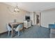 Condo dining area with table and chairs, kitchen view at 1105 S Ocean Blvd. # 106, Myrtle Beach, SC 29577