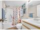 Clean bathroom with shower/tub combo and seashell-themed decor at 310 73Rd Ave. N # 5-C, Myrtle Beach, SC 29572