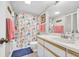 Bathroom with a nautical-themed shower curtain and white vanity at 310 73Rd Ave. N # 5-C, Myrtle Beach, SC 29572