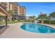 Community pool with surrounding patio and landscaping at 310 73Rd Ave. N # 5-C, Myrtle Beach, SC 29572