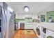 Kitchen with stainless steel appliances and light wood floors at 310 73Rd Ave. N # 5-C, Myrtle Beach, SC 29572