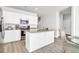 Modern kitchen with white cabinets, granite island, and stainless steel appliances at 438 Archer Ct., Conway, SC 29526