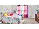 A well-lit bedroom with unicorn-themed bedding and colorful accents at 438 Archer Ct., Conway, SC 29526