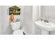 Small bathroom with pedestal sink and decorative shelf at 438 Archer Ct., Conway, SC 29526