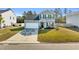 Two-story home exterior with gray siding, a garage, and well-manicured lawn at 438 Archer Ct., Conway, SC 29526