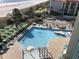 Outdoor pool with surrounding lounge chairs and playground at 201 74Th Ave. N # 1134, Myrtle Beach, SC 29572
