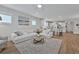 Relaxing living room featuring a sectional sofa and a large window at 7274 Sarteano Dr., Myrtle Beach, SC 29572