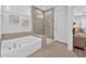 Spa-like bathroom with soaking tub and walk-in shower at 7274 Sarteano Dr., Myrtle Beach, SC 29572