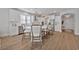 Spacious kitchen with white cabinets, quartz countertops, and an eat-in island at 7274 Sarteano Dr., Myrtle Beach, SC 29572