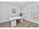 Modern home office with white desk and hardwood floors at 7274 Sarteano Dr., Myrtle Beach, SC 29572