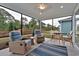 Spacious screened porch with multiple seating areas at 7274 Sarteano Dr., Myrtle Beach, SC 29572