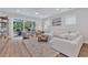 Spacious living area with sectional sofa, access to patio, and large windows at 7274 Sarteano Dr., Myrtle Beach, SC 29572