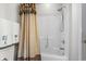 Bathroom with a shower/tub, shower curtain, and linen closet at 493 Shellbank Dr. # 2-B, Longs, SC 29568