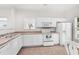 Bright kitchen featuring white cabinets and stainless steel appliances at 493 Shellbank Dr. # 2-B, Longs, SC 29568