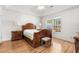 Comfortable bedroom with hardwood floors and large window at 493 Shellbank Dr. # 2-B, Longs, SC 29568