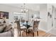 Charming dining area with glass table and four chairs at 493 Shellbank Dr. # 2-B, Longs, SC 29568