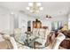 Bright dining area with glass table and four chairs at 493 Shellbank Dr. # 2-B, Longs, SC 29568