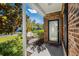 Brick front porch with glass door and landscaping at 493 Shellbank Dr. # 2-B, Longs, SC 29568