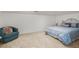 Spacious bedroom with a comfortable bed and sitting chair at 493 Shellbank Dr. # 2-B, Longs, SC 29568