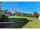 Large backyard with grassy lawn and privacy hedge at 879 Waterton Ave., Myrtle Beach, SC 29579