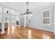 Open concept dining room with hardwood floors and living room view at 879 Waterton Ave., Myrtle Beach, SC 29579