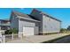 Attached garage with white door and brick base at 879 Waterton Ave., Myrtle Beach, SC 29579