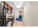 Small condo kitchen with dark cabinets and appliances at 5200 N Ocean Blvd. # 1231, Myrtle Beach, SC 29577
